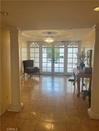 a lobby with furniture and floor to ceiling window