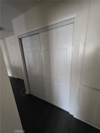 a kitchen with a sink cabinets and a refrigerator