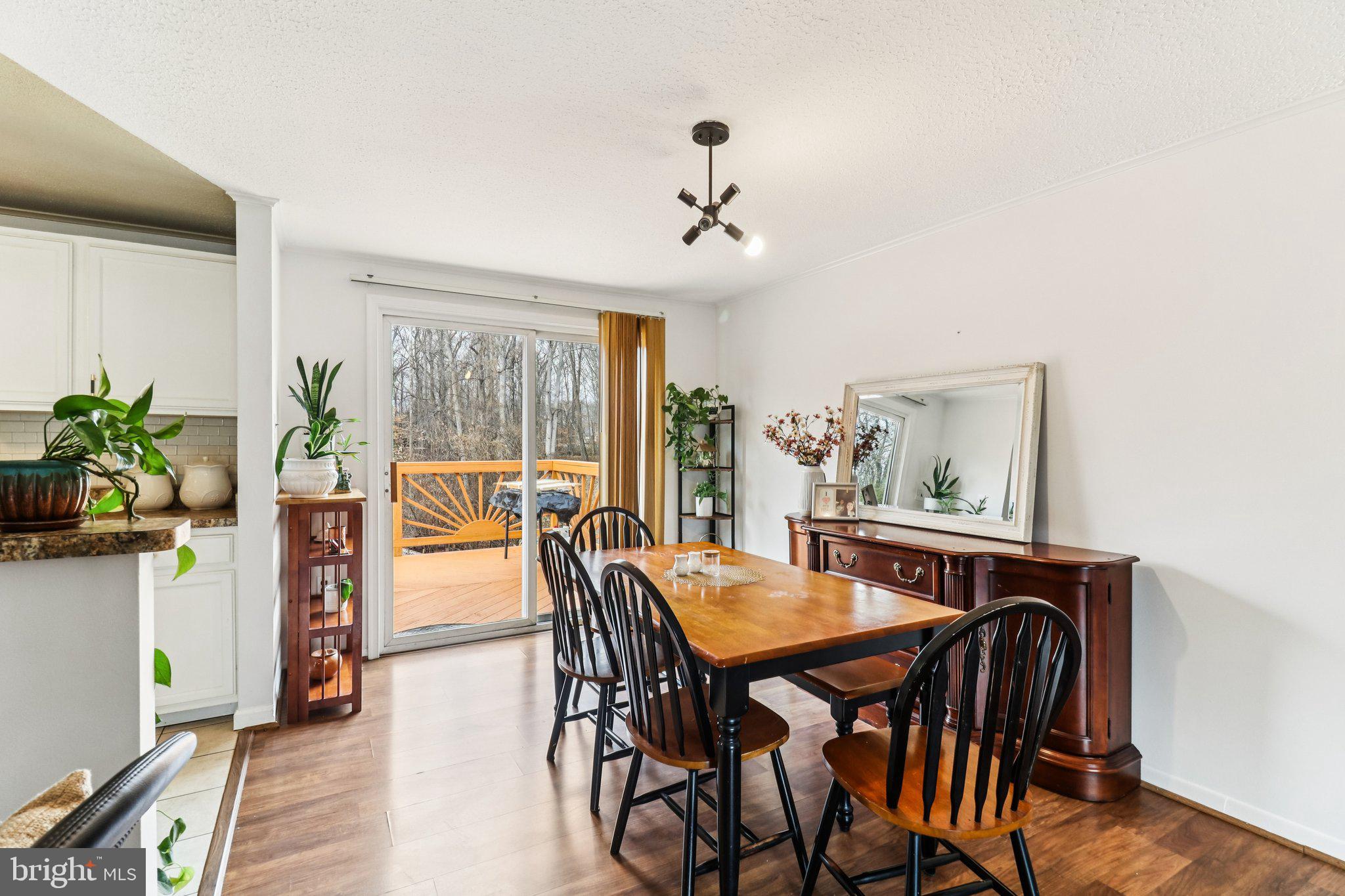 14617 Livingston Road Accokeek, MD 20607 - Photo 11 of 53 a view of a dining room with furniture window and wooden floor