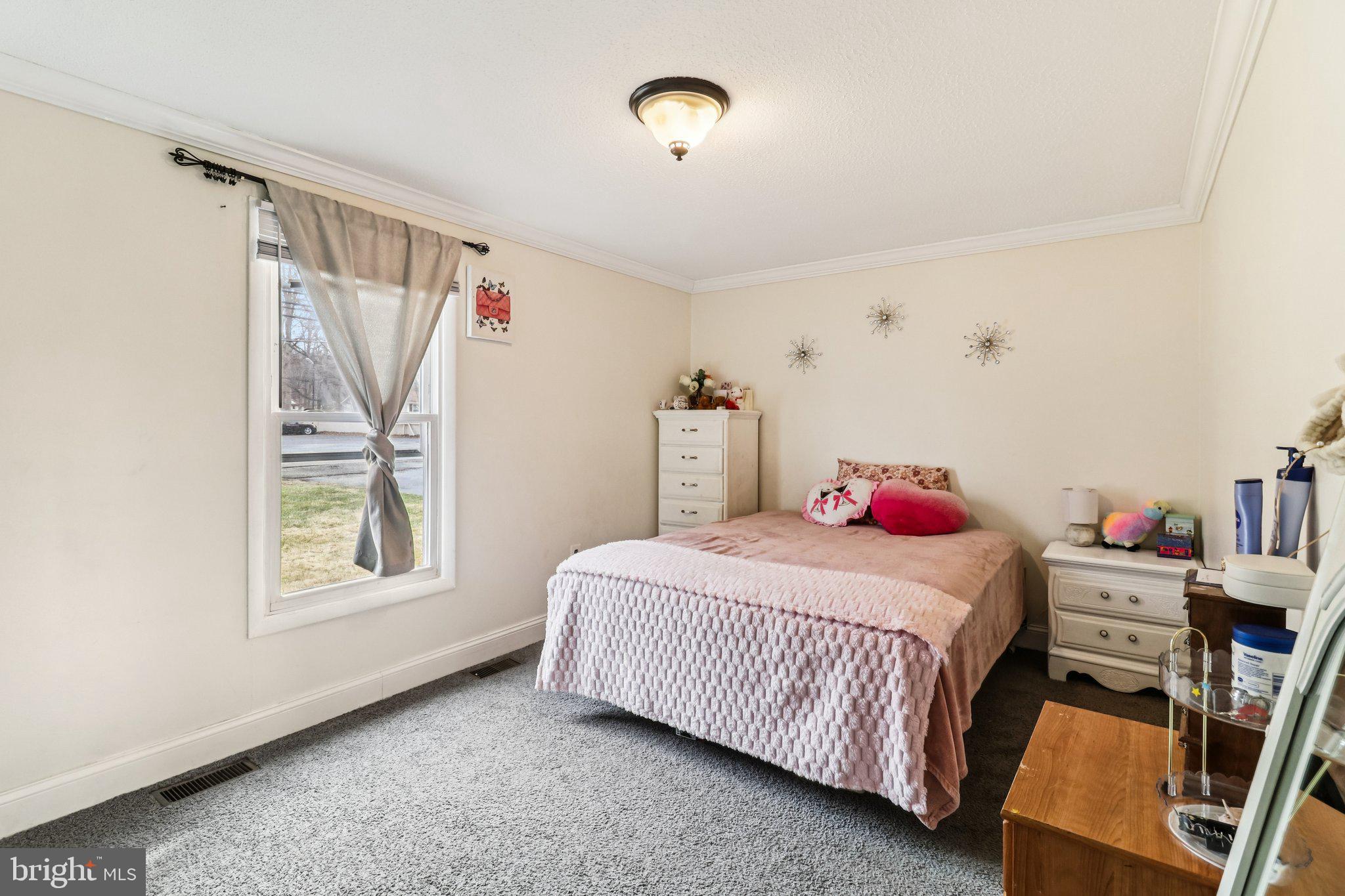 14617 Livingston Road Accokeek, MD 20607 - Photo 29 of 53 a bedroom with a bed and a window