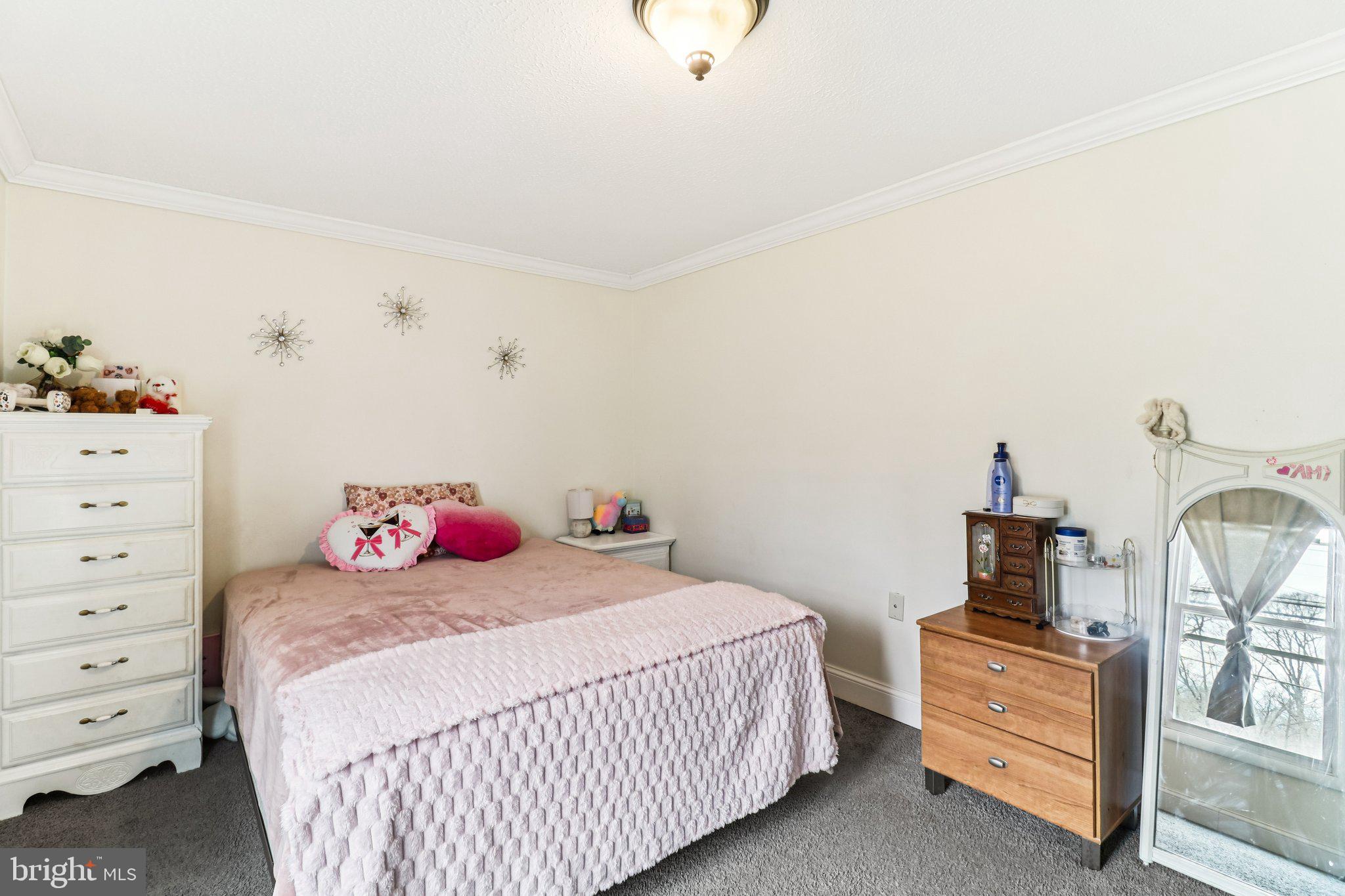 14617 Livingston Road Accokeek, MD 20607 - Photo 30 of 53 a bedroom with a bed and wooden floor