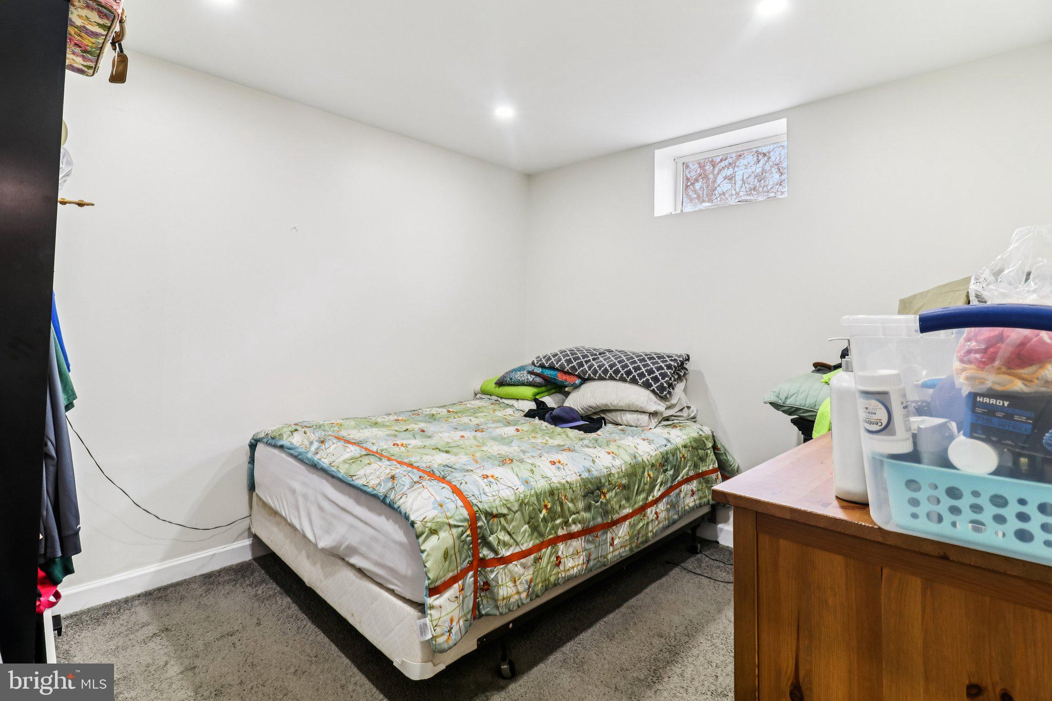 14617 Livingston Road Accokeek, MD 20607 - Photo 33 of 53 a bedroom with a bed and dresser