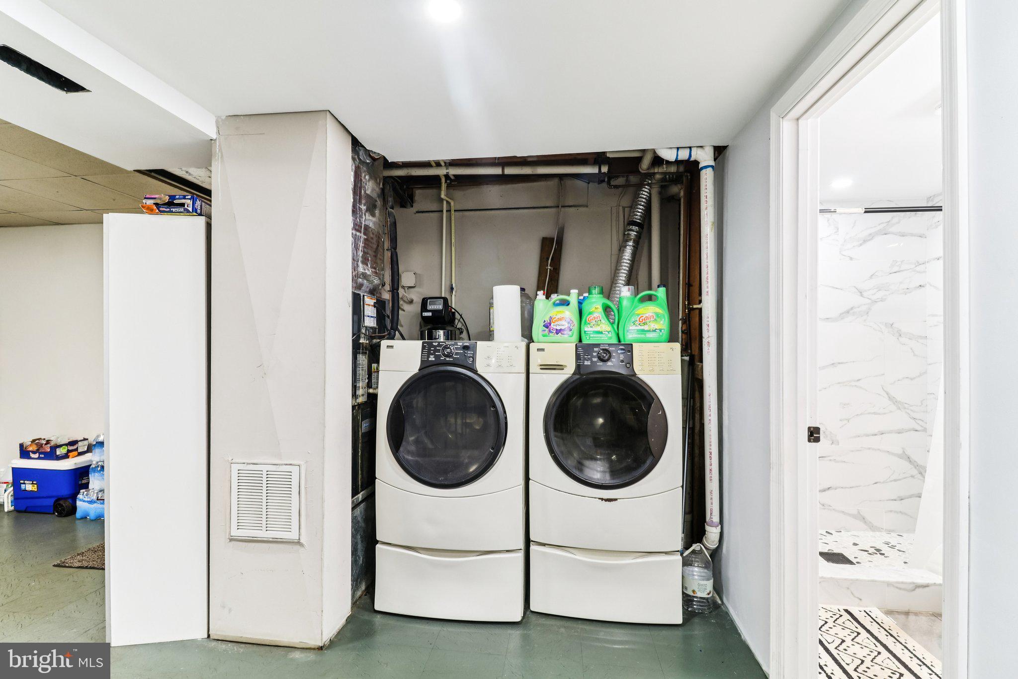 14617 Livingston Road Accokeek, MD 20607 - Photo 39 of 53 a utility room with sink dryer and washer