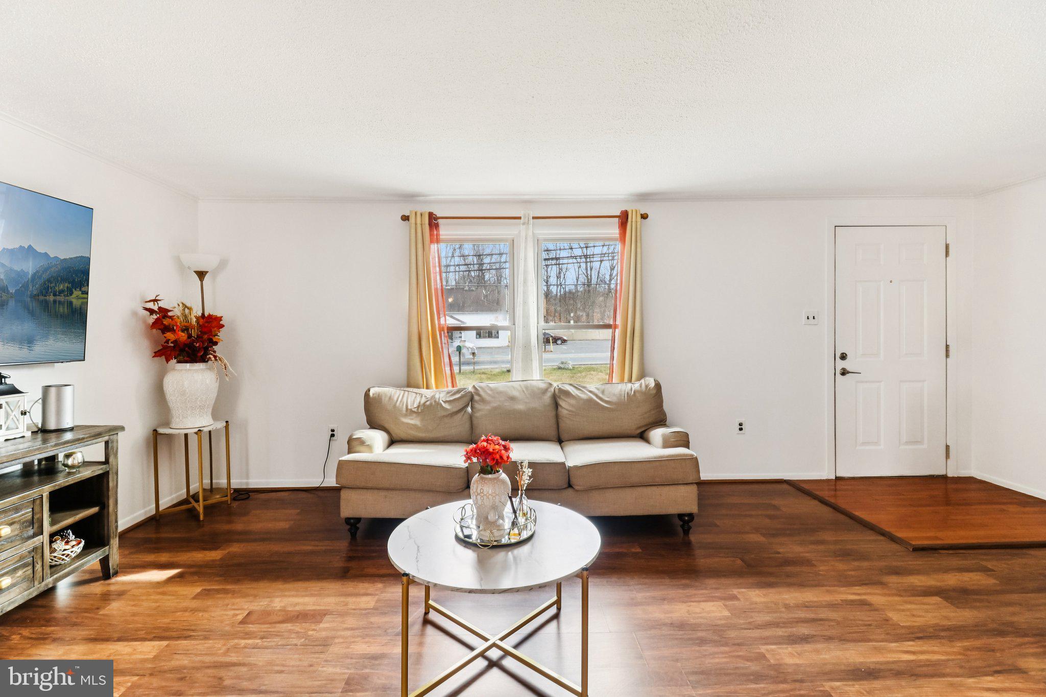 14617 Livingston Road Accokeek, MD 20607 - Photo 6 of 53 a living room with furniture and a flat screen tv