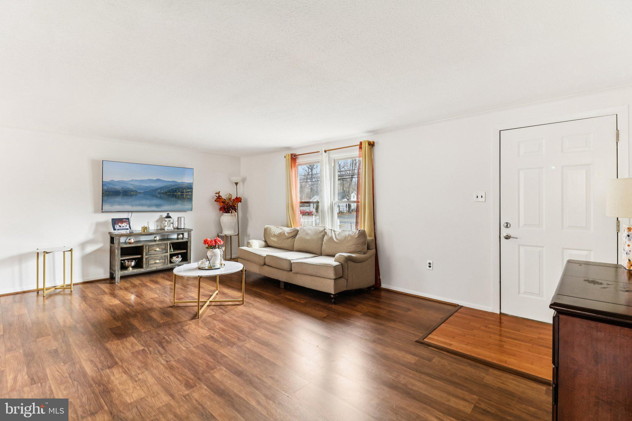 14617 Livingston Road Accokeek, MD 20607 - Photo 10 of 53 a living room with furniture and a flat screen tv
