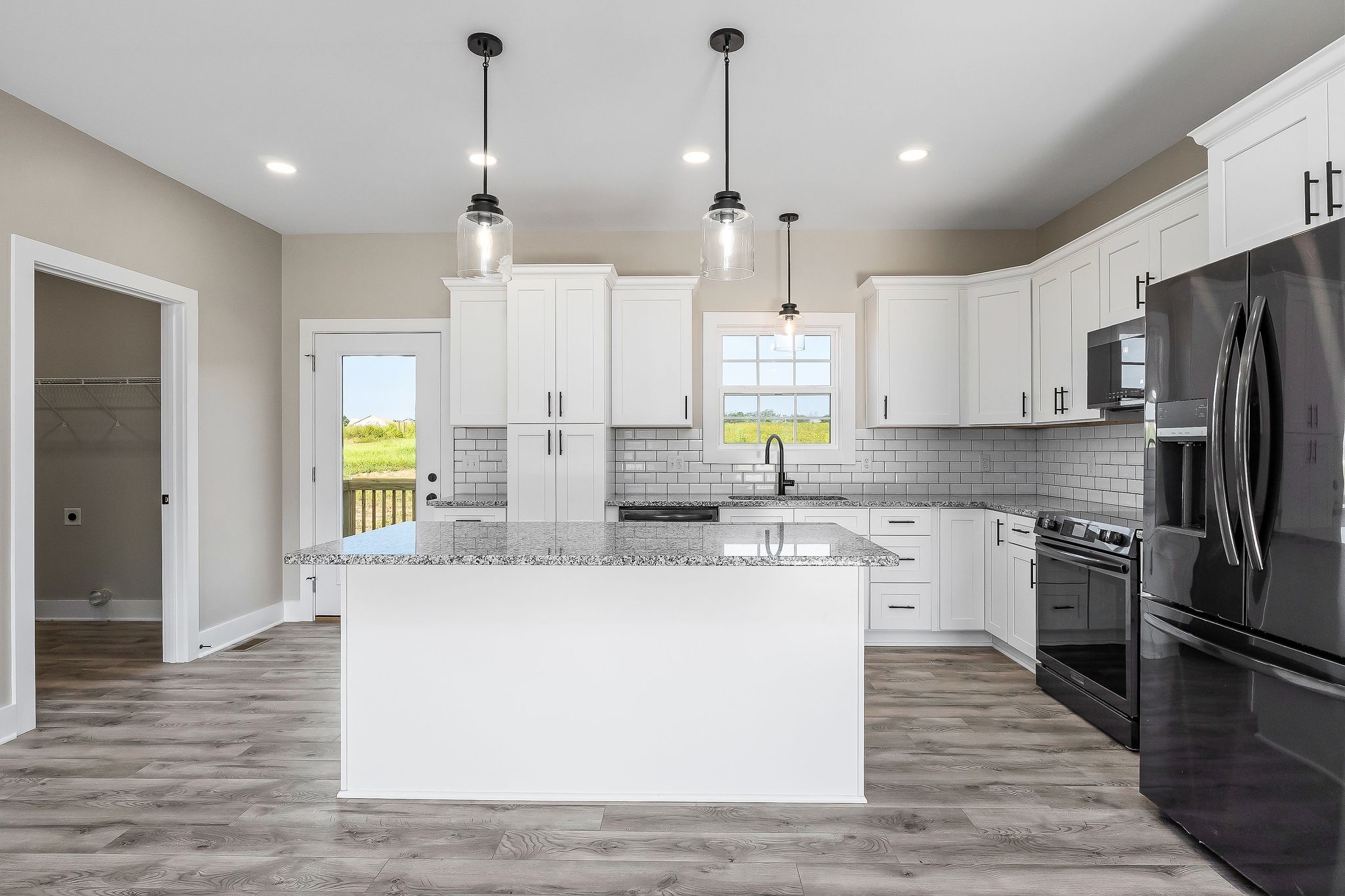 912 Frank Anderson Road Sparta, TN 38583 - Photo 11 of 28 a large kitchen with stainless steel appliances granite countertop a refrigerator a stove a sink and a refrigerator