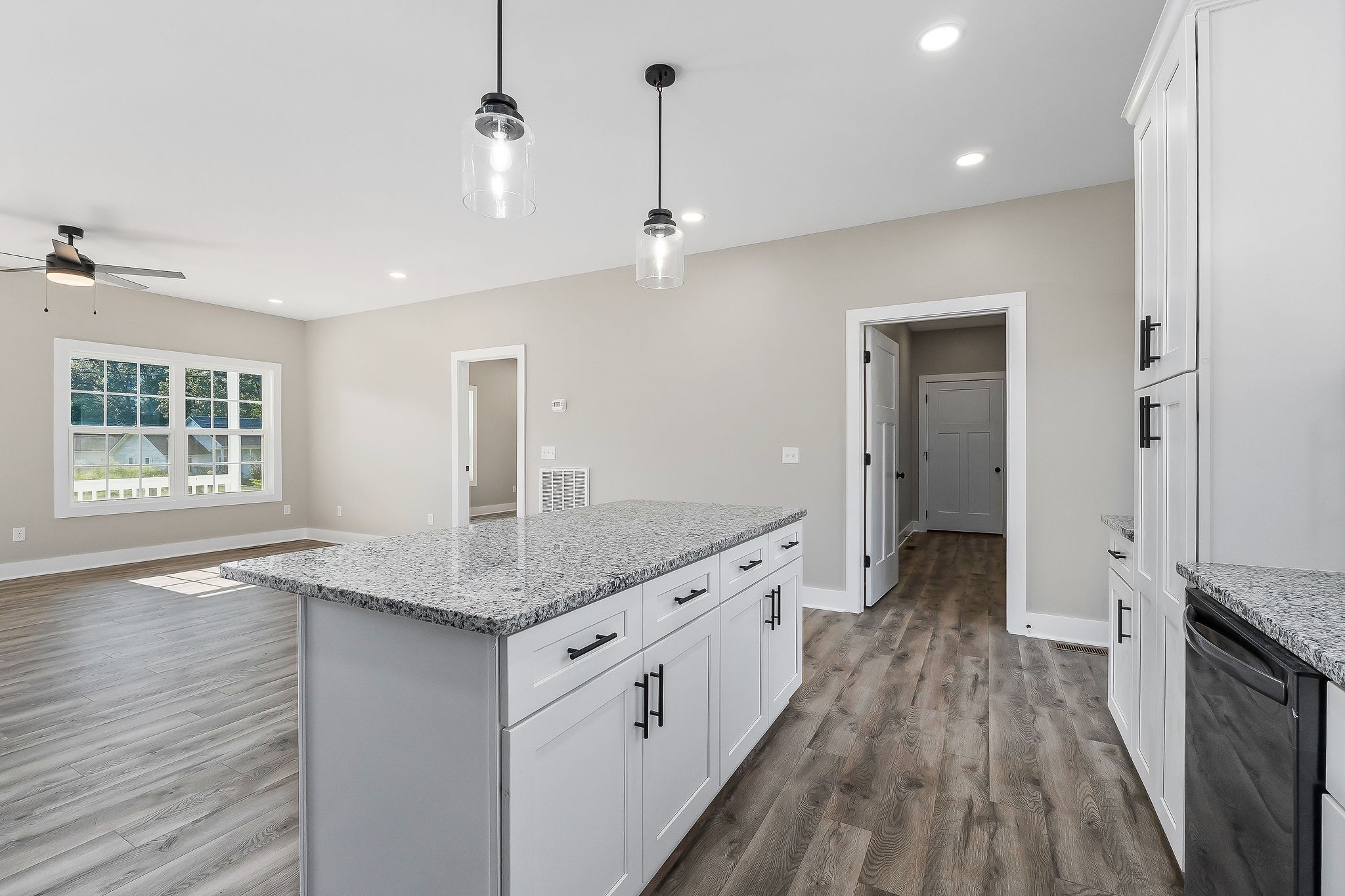 912 Frank Anderson Road Sparta, TN 38583 - Photo 17 of 28 a bathroom with a granite countertop sink a large mirror and a refrigerator