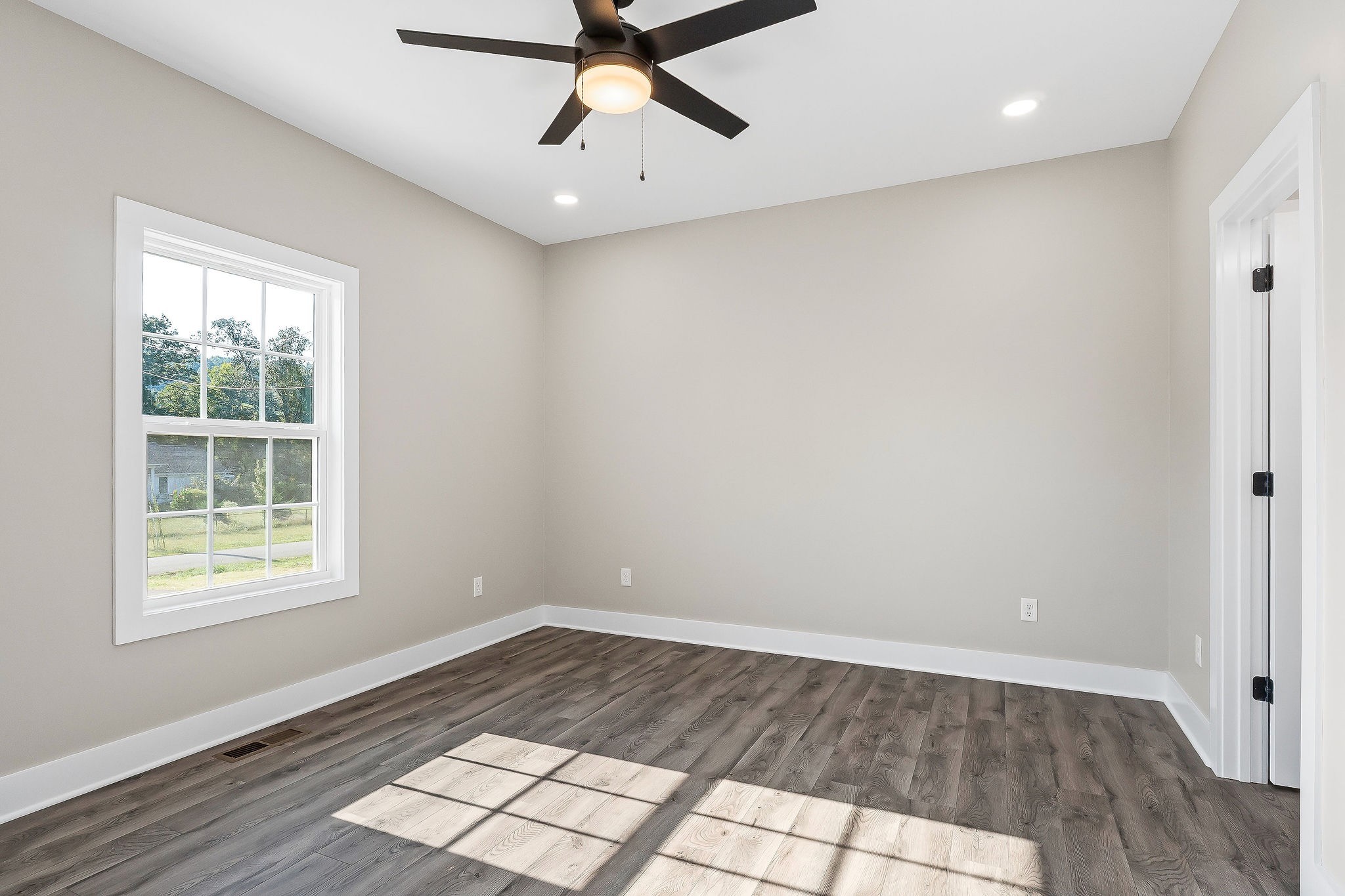 912 Frank Anderson Road Sparta, TN 38583 - Photo 20 of 28 wooden floor in an empty room with a window
