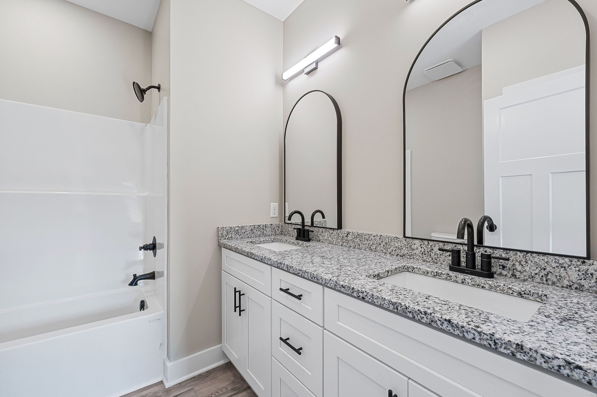 912 Frank Anderson Road Sparta, TN 38583 - Photo 22 of 28 a bathroom with a granite countertop sink a mirror and shower