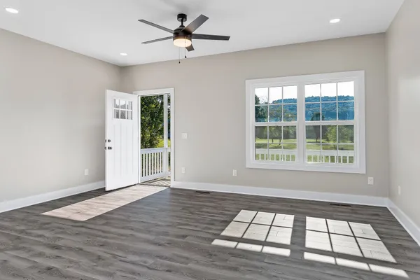 a large kitchen with stainless steel appliances granite countertop a refrigerator a stove a sink and a refrigerator