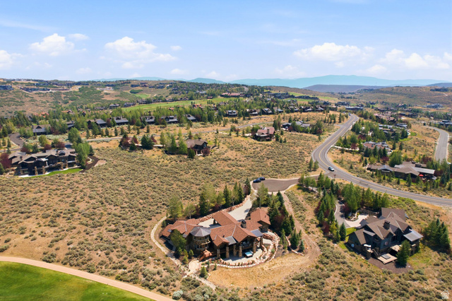7885 North Rabbitbrush Court, Unit 13 Park City, UT 84098 - Photo 87 of 88 Mountainous landscape featuring residential properties, paved roads, and natural vegetation
