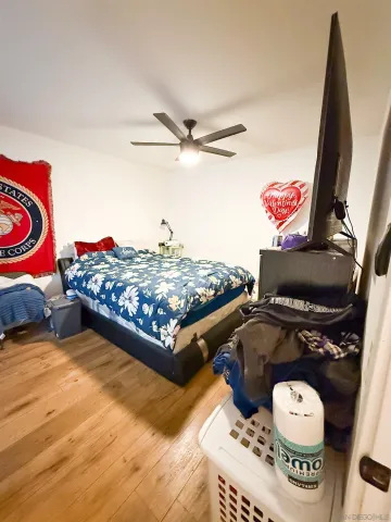 a view of a backyard with table and chairs with wooden fence