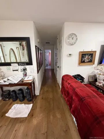 a living room with lots of furniture and gym equipment