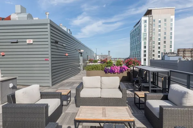a view of a patio with couches and potted plants