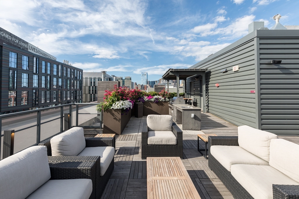 32 Traveler Street, Unit PH8 Boston, MA 02118 - Photo 32 of 38 a view of a patio with couches and potted plants