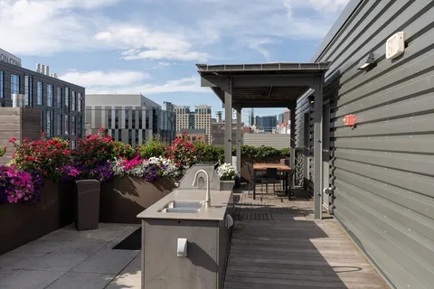 a view of an outdoor dining space with a patio