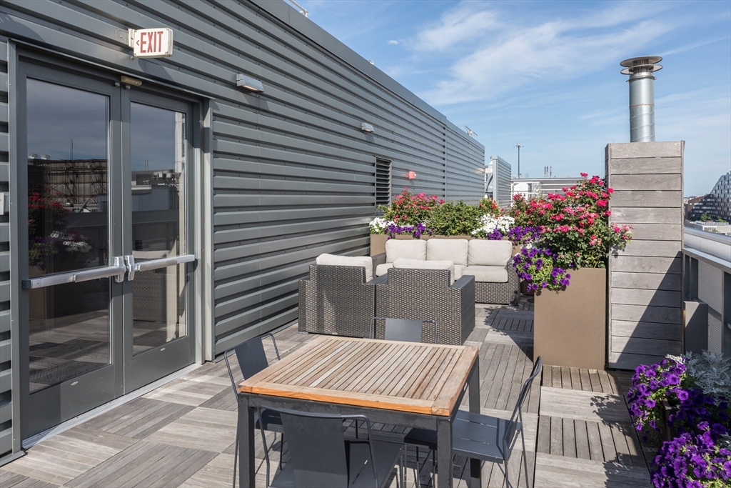 32 Traveler Street, Unit PH8 Boston, MA 02118 - Photo 38 of 38 a view of an outdoor dining space with a patio