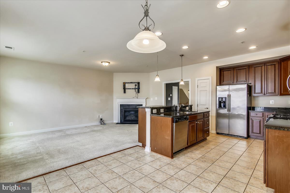3602 Spring Hollow Lane Frederick, MD 21704 - Photo 11 of 25 a kitchen with refrigerator and microwave