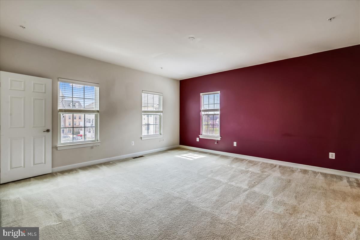 3602 Spring Hollow Lane Frederick, MD 21704 - Photo 15 of 25 an empty room with windows and closet