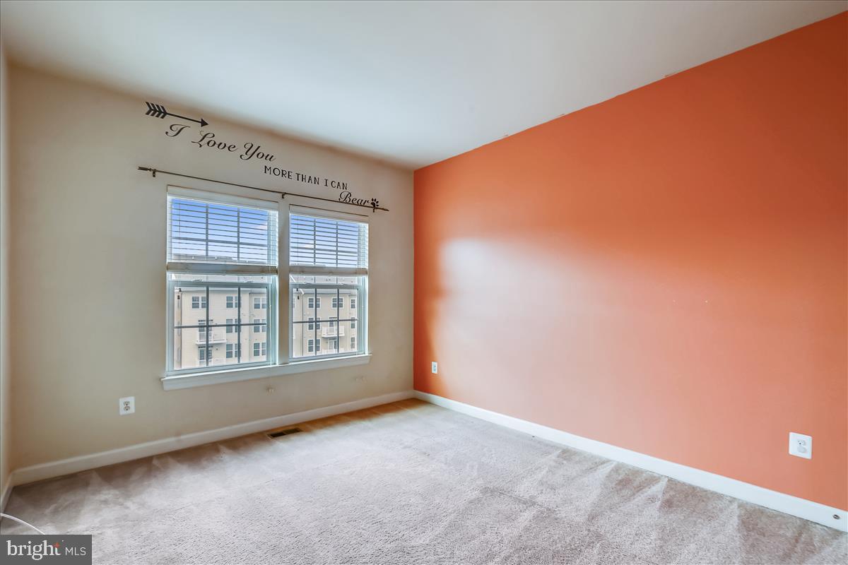 3602 Spring Hollow Lane Frederick, MD 21704 - Photo 19 of 25 a view of an empty room with a window