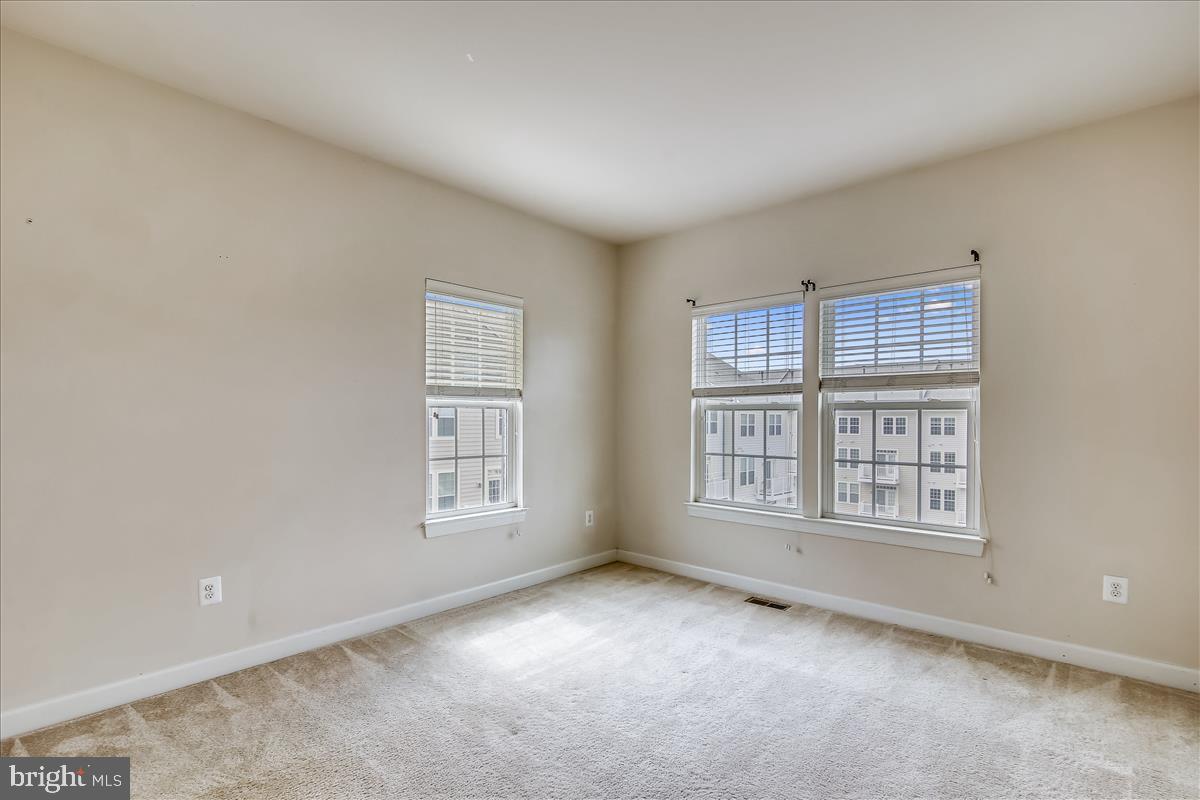 3602 Spring Hollow Lane Frederick, MD 21704 - Photo 22 of 25 a view of an empty room with windows