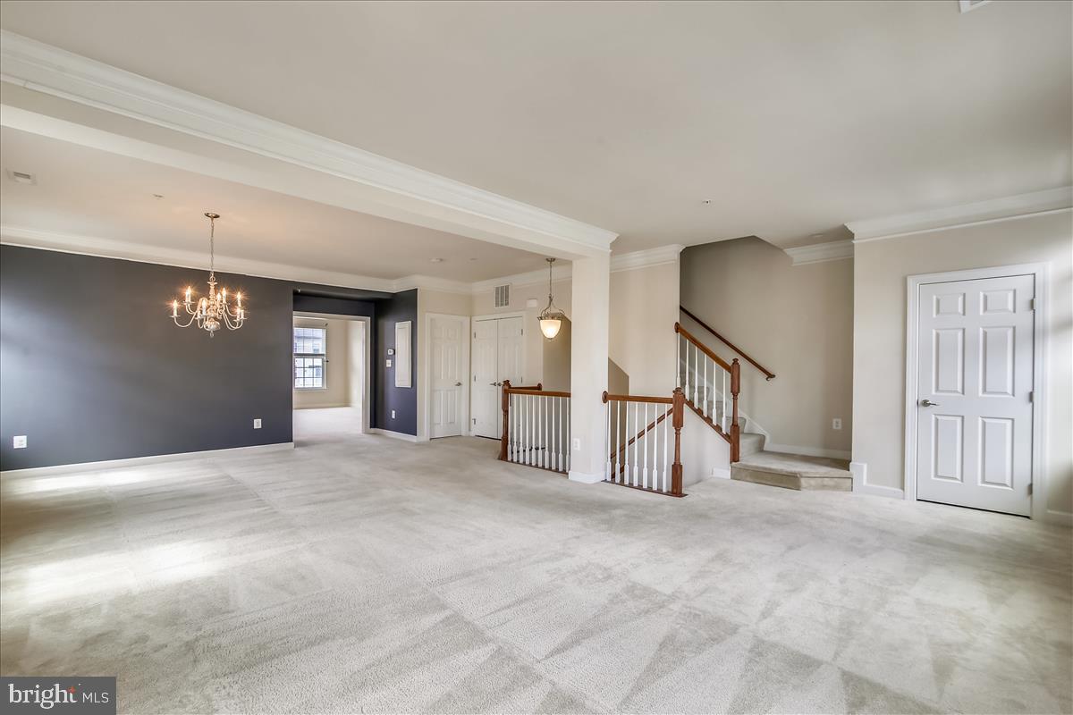 3602 Spring Hollow Lane Frederick, MD 21704 - Photo 3 of 25 a view of an empty room with a fireplace and a window