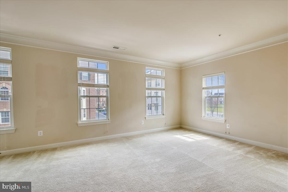 3602 Spring Hollow Lane Frederick, MD 21704 - Photo 4 of 25 an empty room with windows