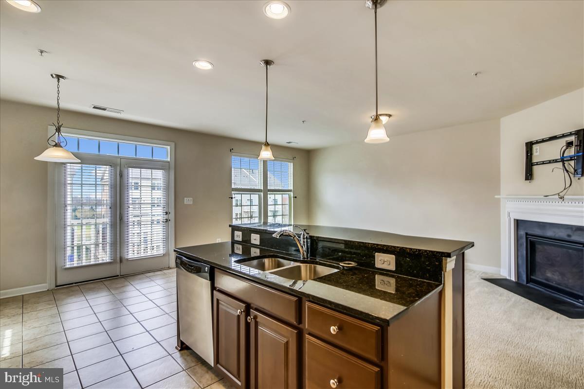 3602 Spring Hollow Lane Frederick, MD 21704 - Photo 5 of 25 a kitchen with a sink stove and cabinets