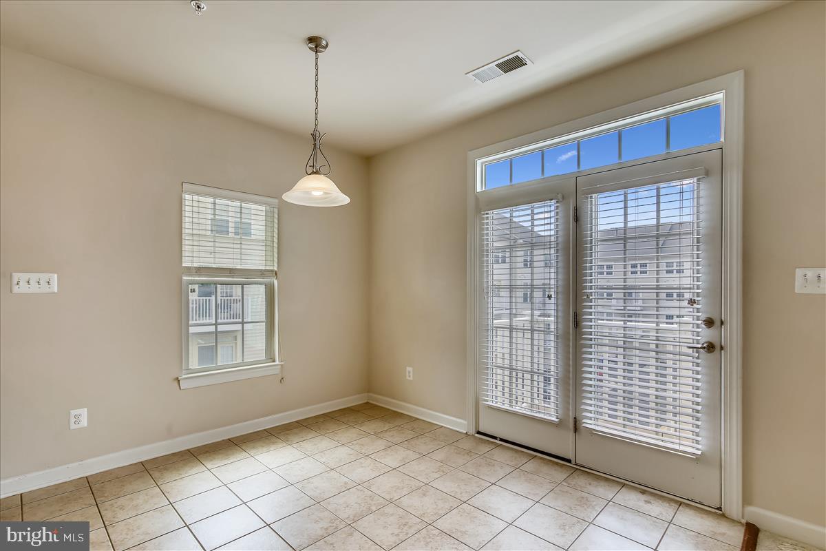 3602 Spring Hollow Lane Frederick, MD 21704 - Photo 6 of 25 a view of empty room with windows