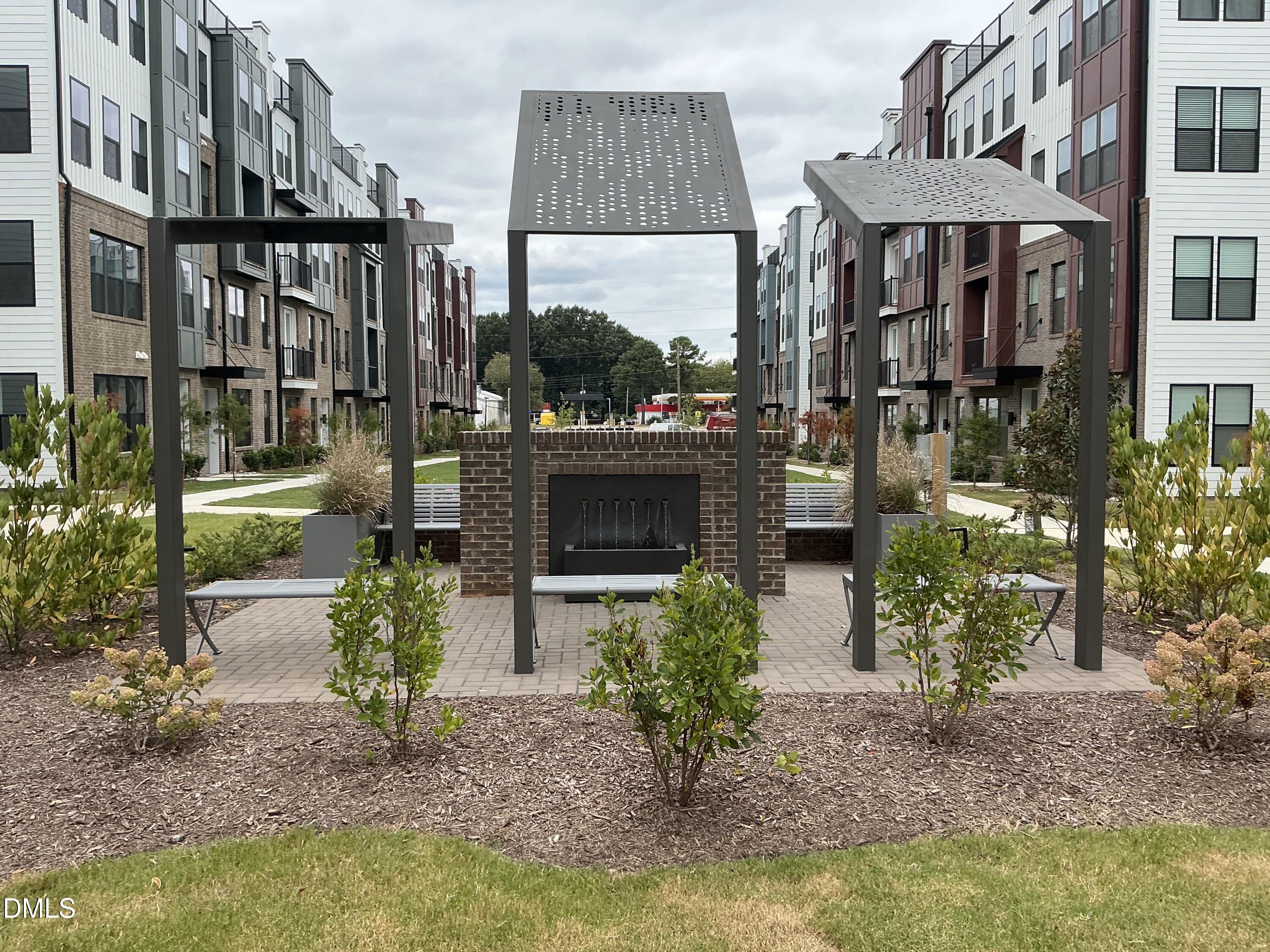 1247 Shaw View Alley, Unit 201 Raleigh, NC 27601 - Photo 43 of 49 mall seating and fountain