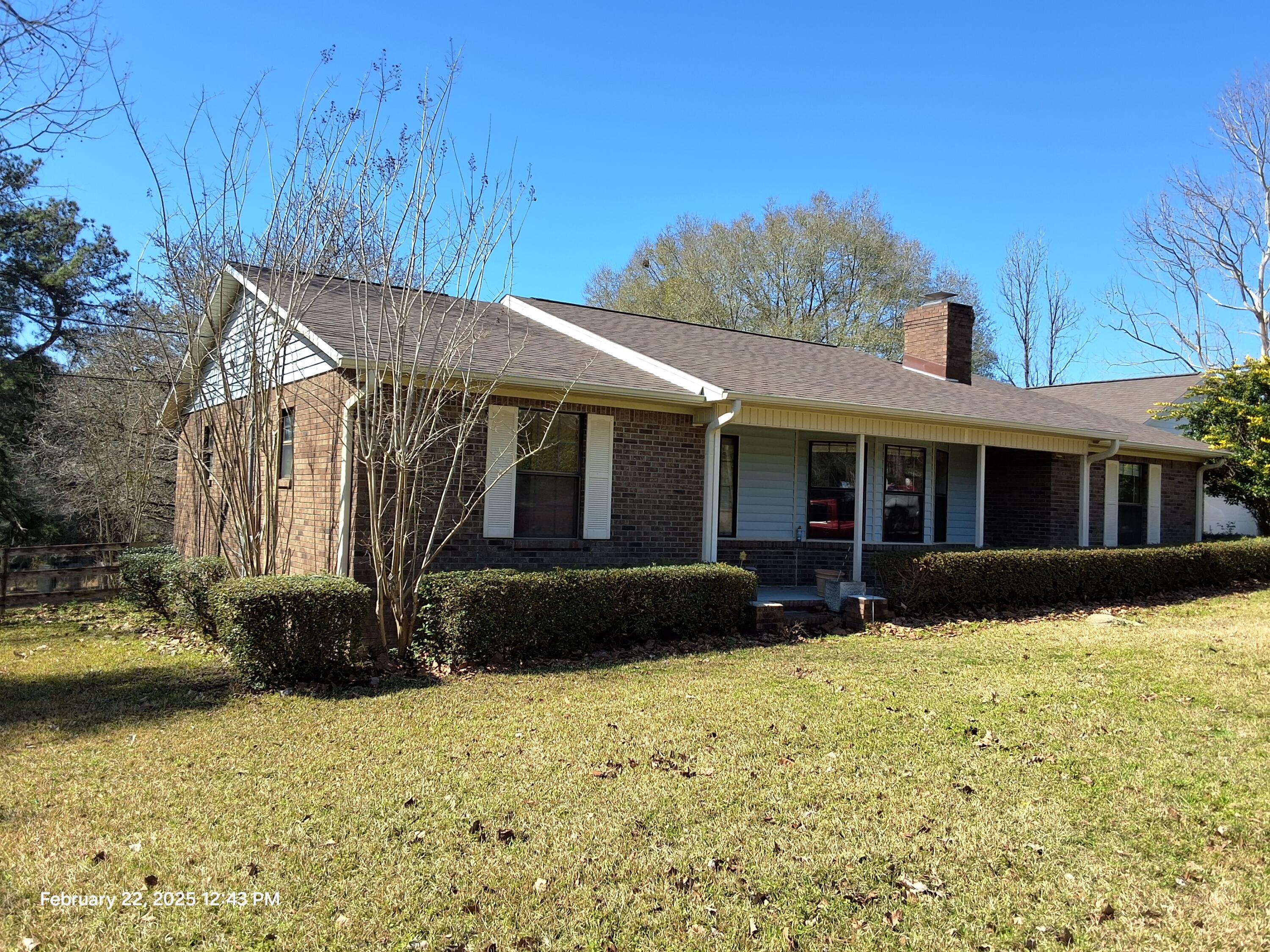 5652 Old Bethel Road Crestview, FL 32536 - Photo 1 of 23 a front view of a house with a yard