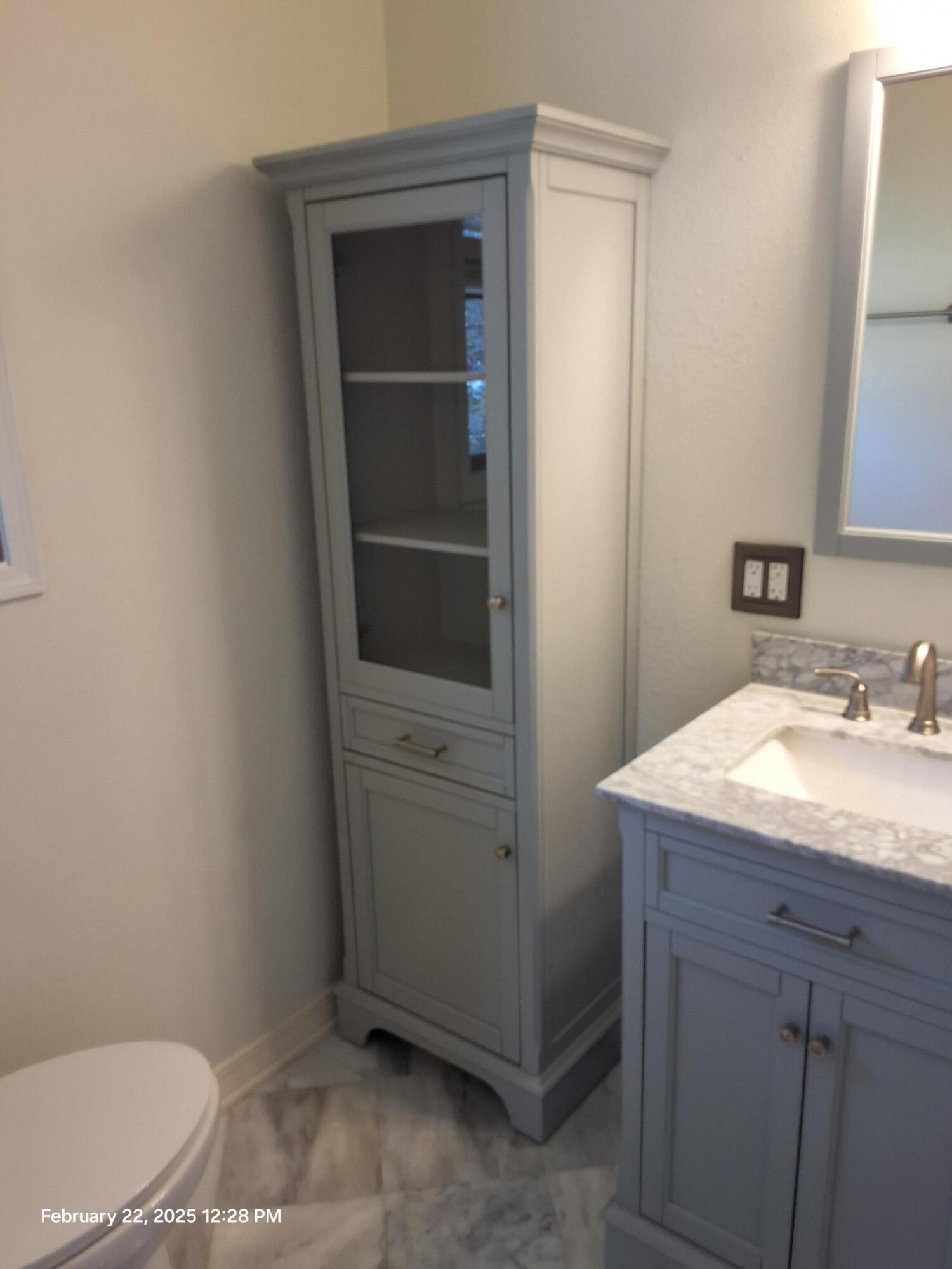 5652 Old Bethel Road Crestview, FL 32536 - Photo 17 of 23 a bathroom with a sink toilet and vanity