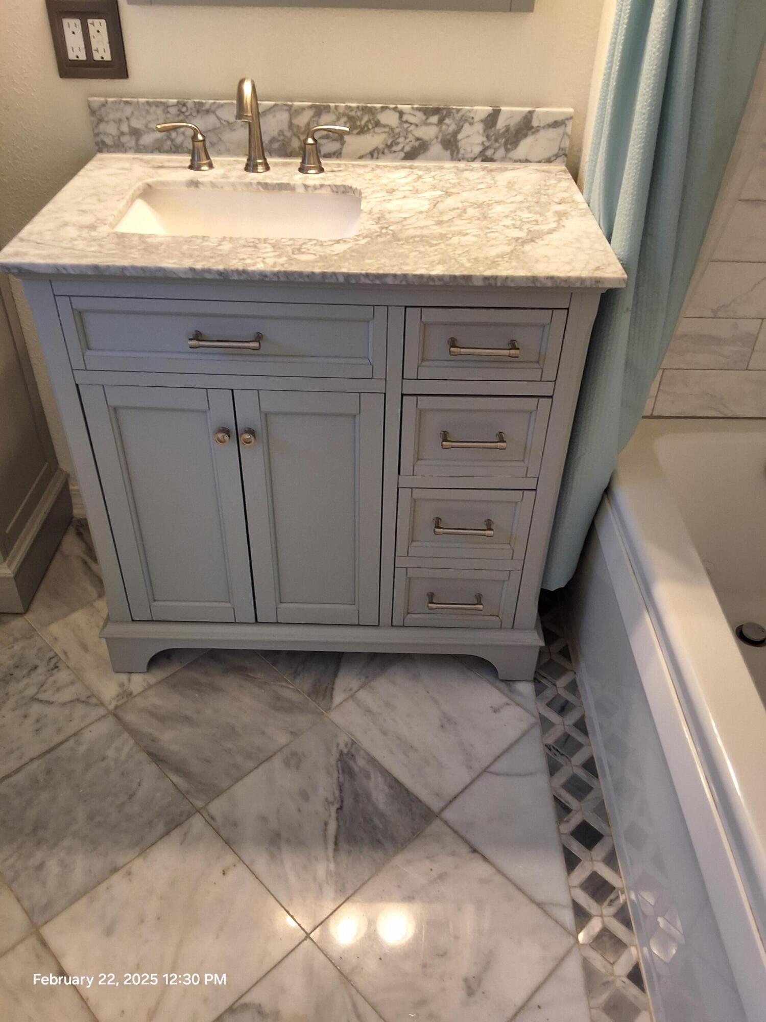 5652 Old Bethel Road Crestview, FL 32536 - Photo 19 of 23 a bathroom with a granite countertop sink and a mirror