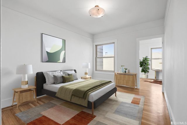 a living room with furniture a fireplace and a floor to ceiling window