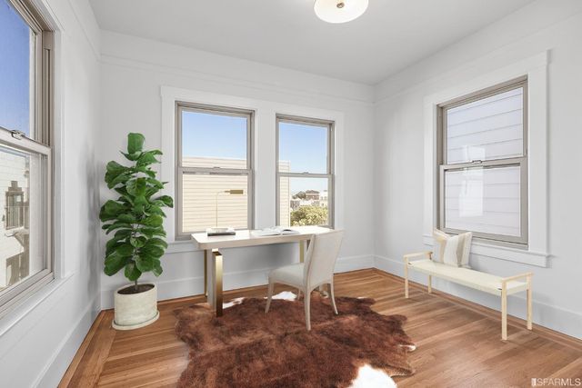 a view of a livingroom with wooden floor