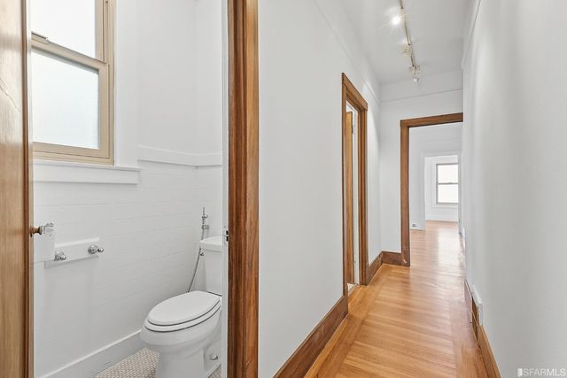 a view of livingroom with hardwood floor and a ceiling fan