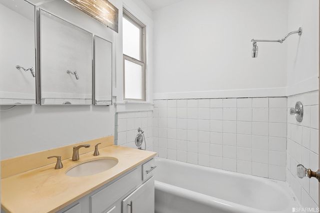 a kitchen with a sink stove and refrigerator