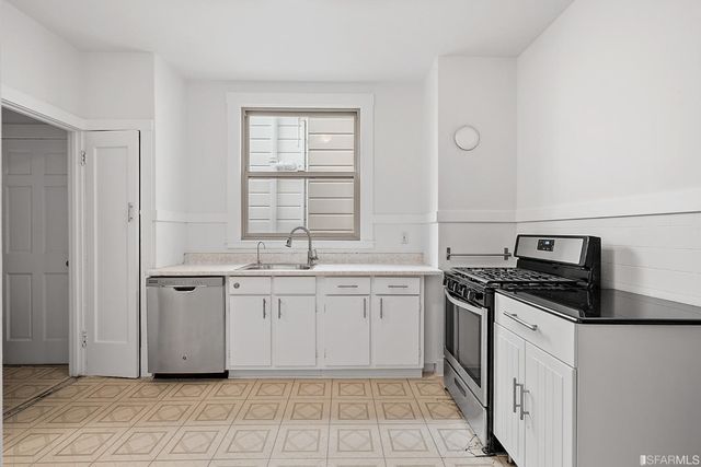 a view of a patio with couches table and chairs and potted plants