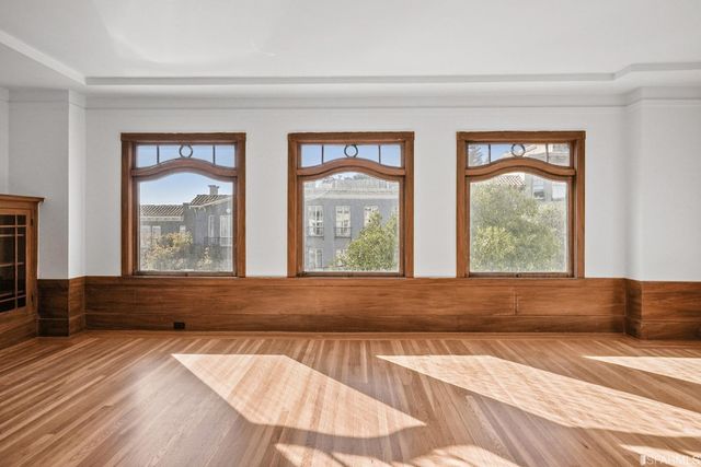 a view of a livingroom with wooden floor