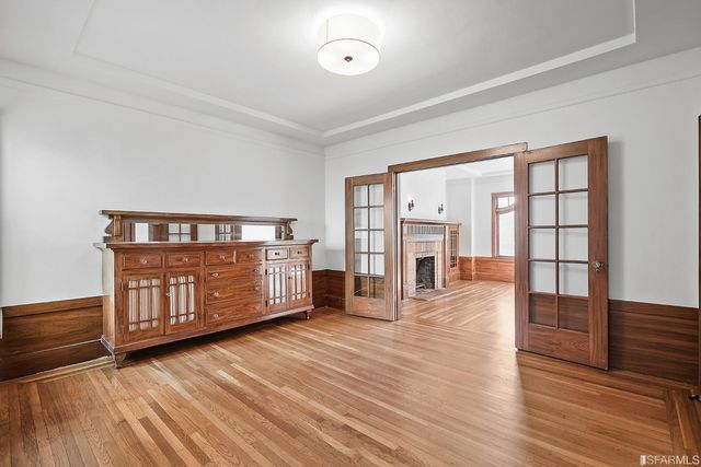 a kitchen with white cabinets and a sink