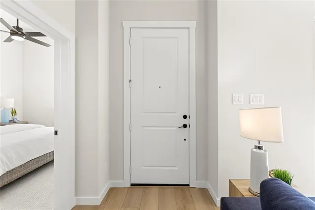 a view of bedroom with a bed and wooden floor