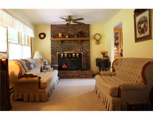 137 Heck Road Sarver, PA 16055 - Photo 4 of 12 Living Room. Plush new carpet! Wall of windows overlooking front covered porch! Great wood burning fireplace with blowers keeps this main floor cozy and warm on cold winter nights!