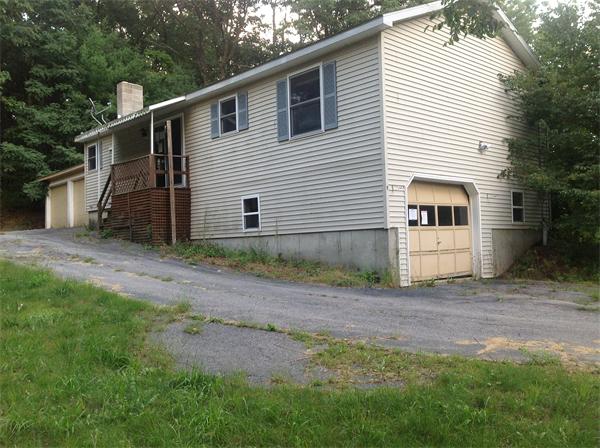 9 West Hill Road Troy, NH 03465 - Photo 2 of 5 a front view of a house with a yard