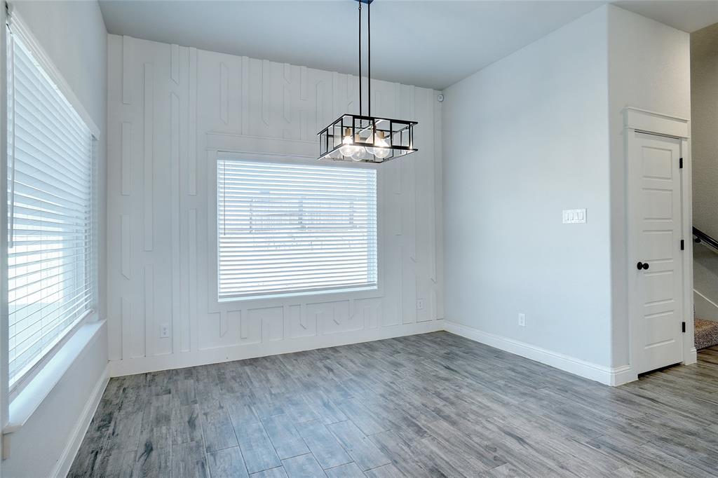 124 William Lane Godley, TX 76044 - Photo 16 of 35 a view of a room with wooden floor cabinets and a window