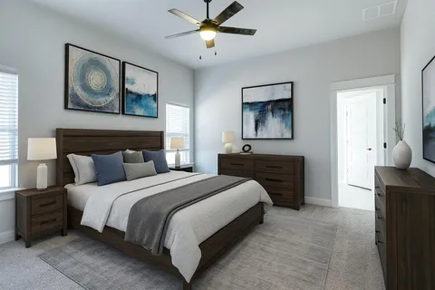 a bedroom with a bed and a chandelier