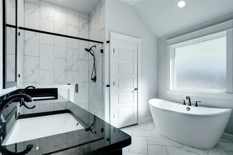 a bathroom with a sink and a bathtub