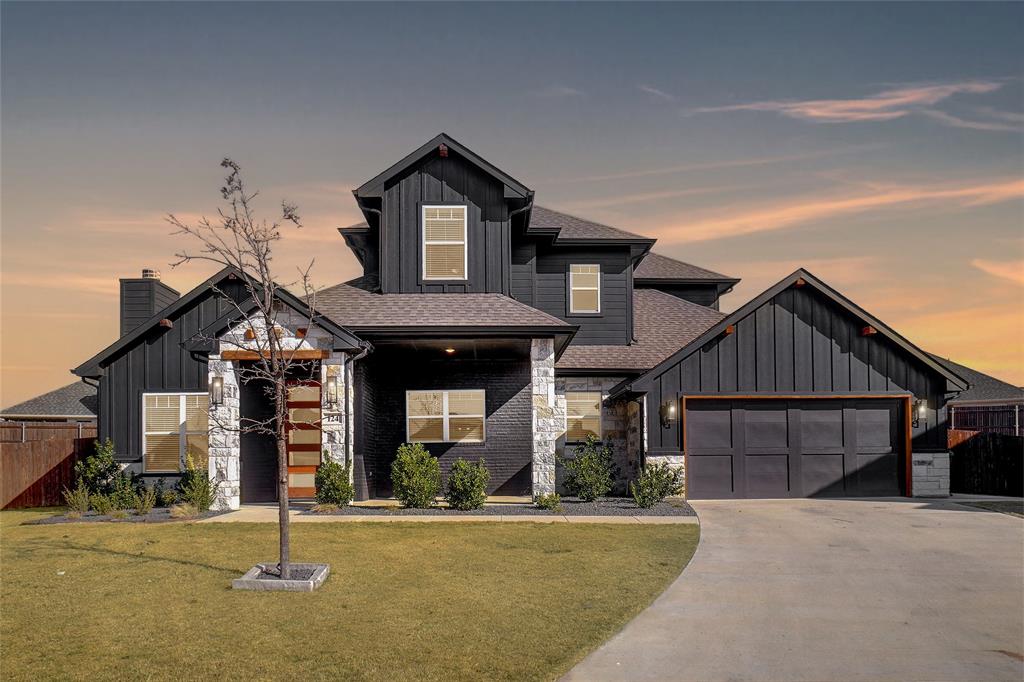 124 William Lane Godley, TX 76044 - Photo 2 of 32 a front view of a house with a yard
