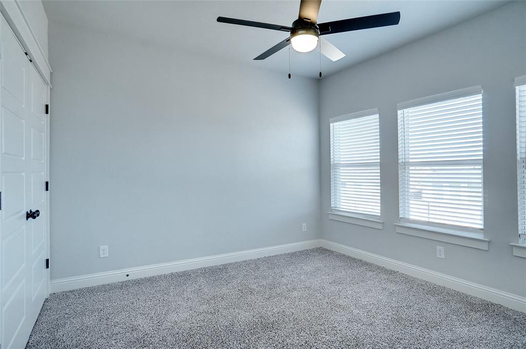 124 William Lane Godley, TX 76044 - Photo 21 of 32 an empty room with a window and a fan