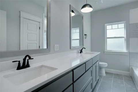 a bathroom with a sink and a toilet