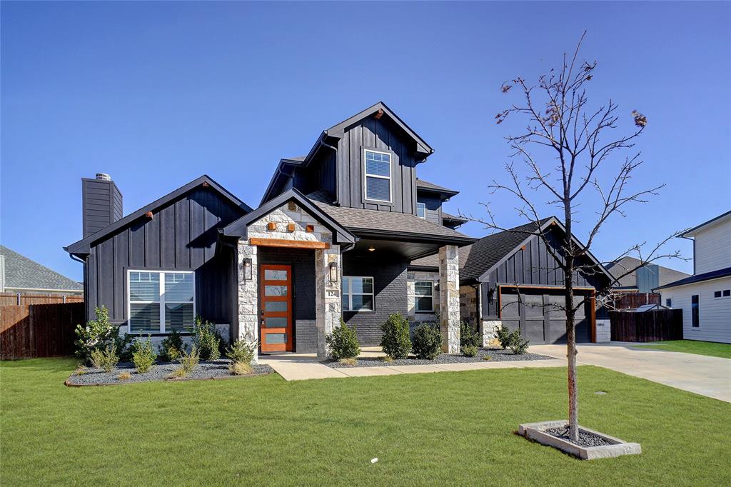 124 William Lane Godley, TX 76044 - Photo 3 of 32 a front view of a house with a yard